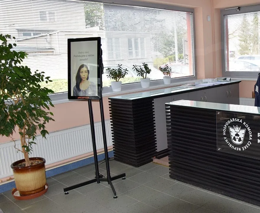aReception kiosk on a stand beside the reception desk of the Brno Regional Chamber of Commerce