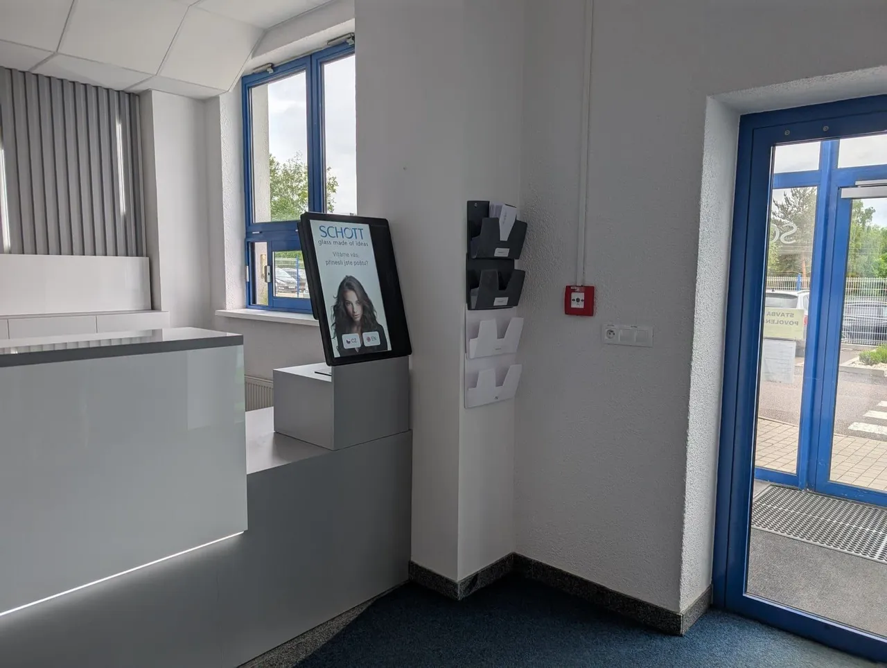 aReception kiosk at the SCHOTT reception in Lanškroun, by the entrance door