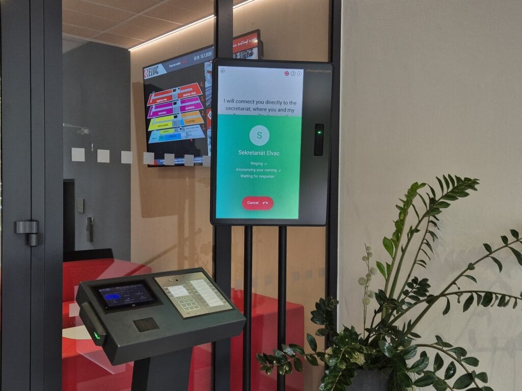 aReception kiosk at ELVAC phone-connecting a visitor to the right person